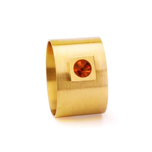 Das Bild zeigt einen goldenen Ring mit rotem Stein